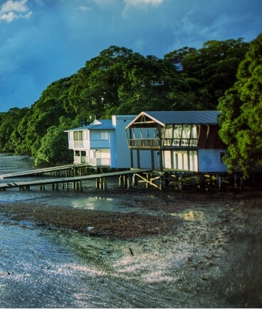 Two beach houses at low tide