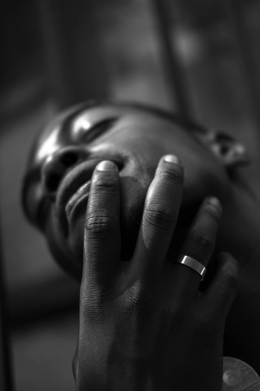 A hand wearing a steel ring